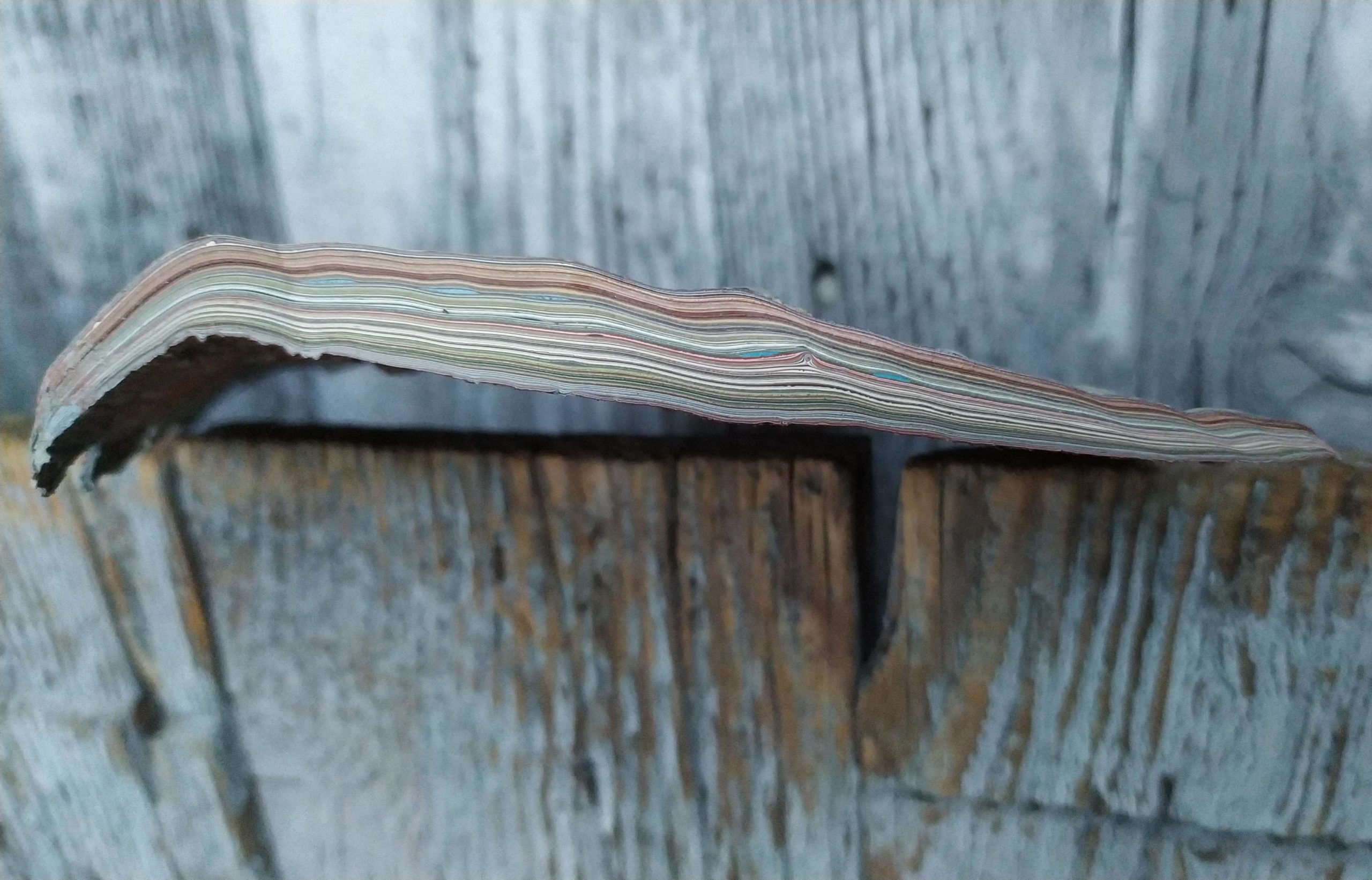 Cross section of layers of paint showing deformation due to imperfections magnified with each layer.